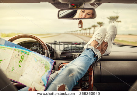 stock-photo-young-woman-alone-car-traveler-with-map-269260949
